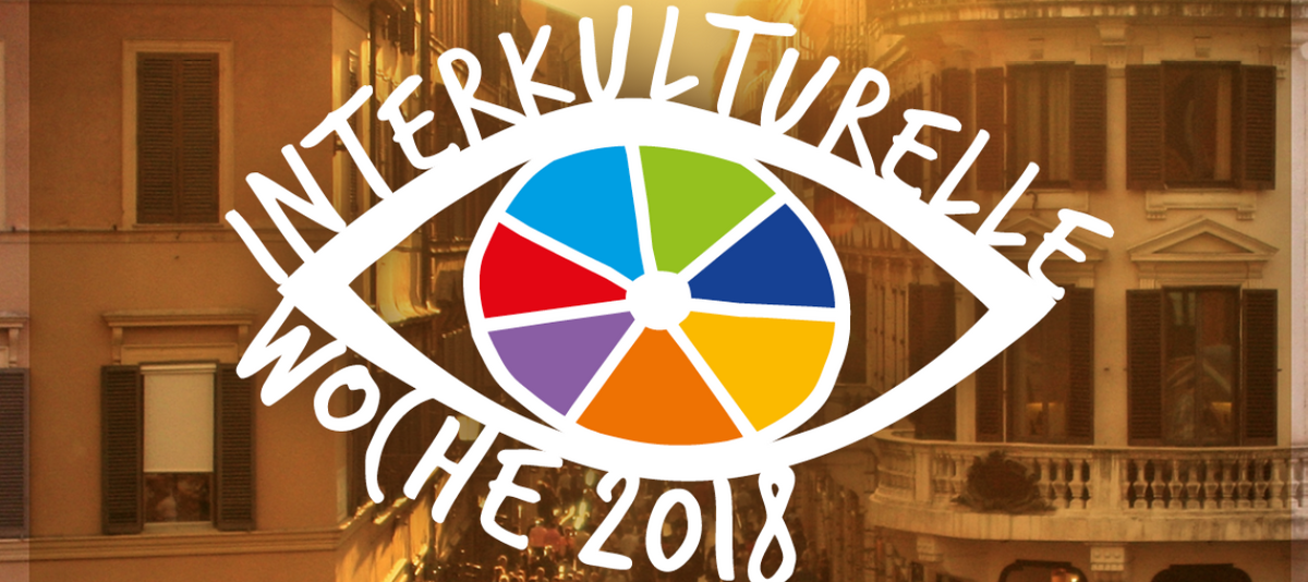 Ein illustriertes Auge mit bunten Farben, um das geschrieben steht "Interkulturelle Woche 2018"